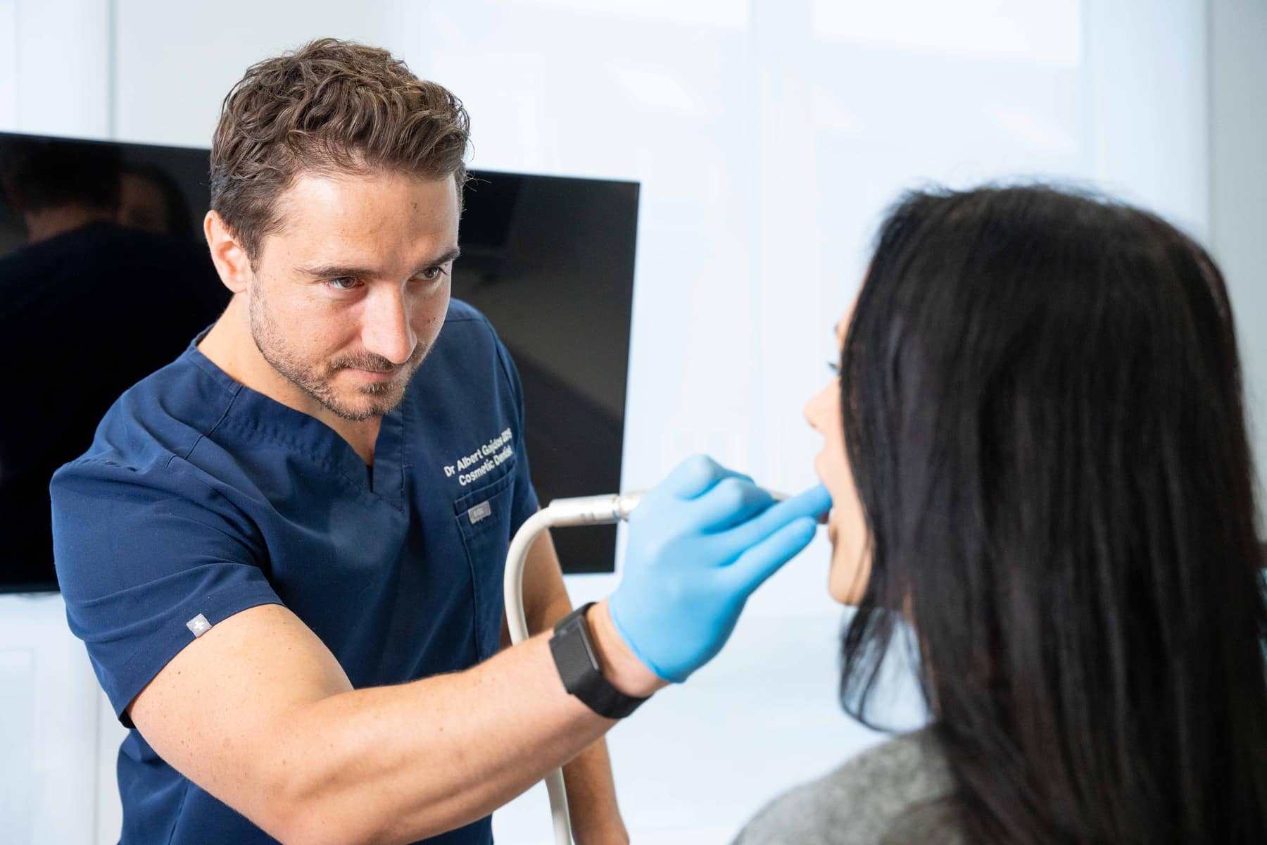 Dr. Albert Gajdos hand-sculpting composite bonding at Smile Rooms Windsor
