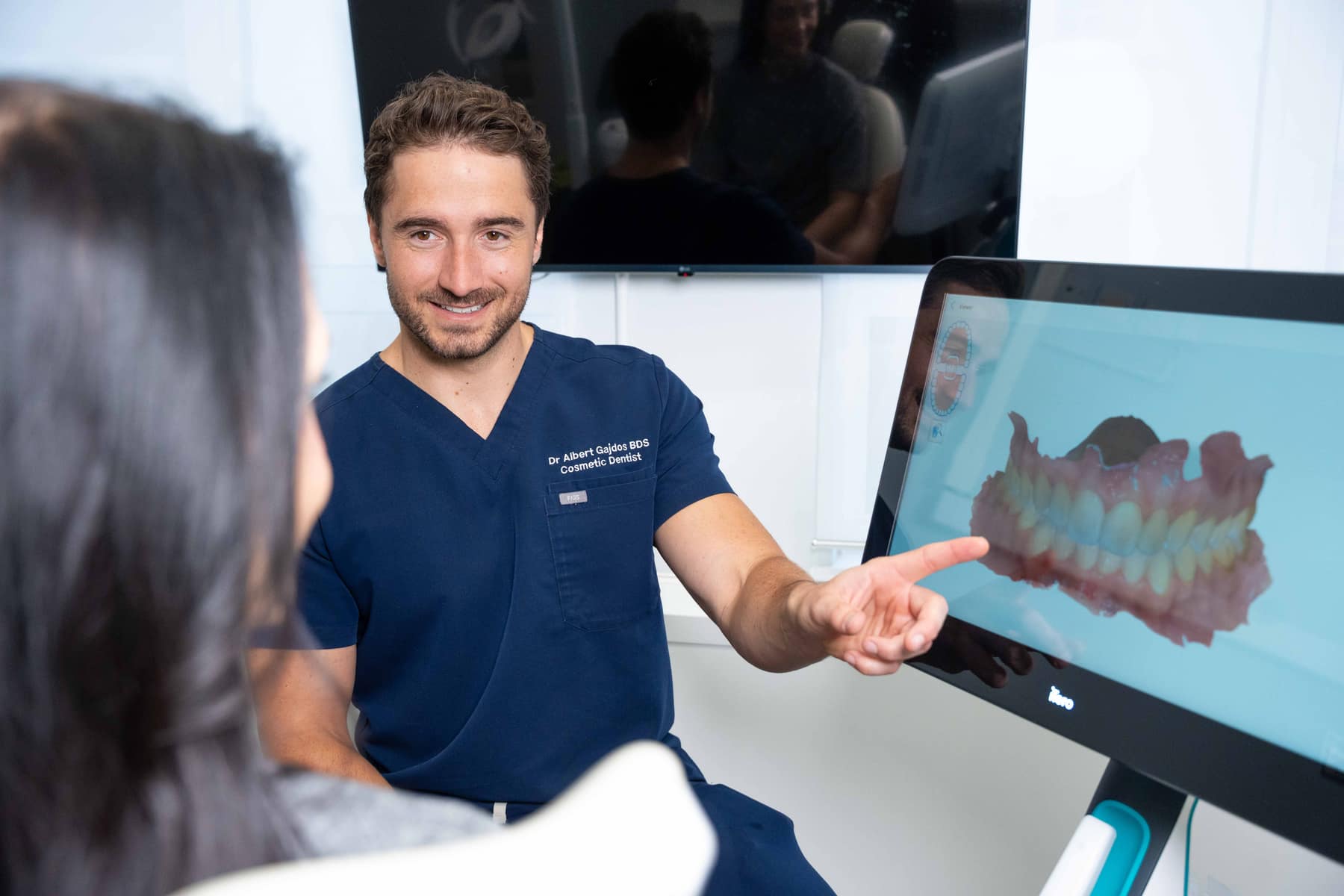 Dr. Albert Gajdos reviewing a patient's 3D Invisalign scan at Smile Rooms Windsor